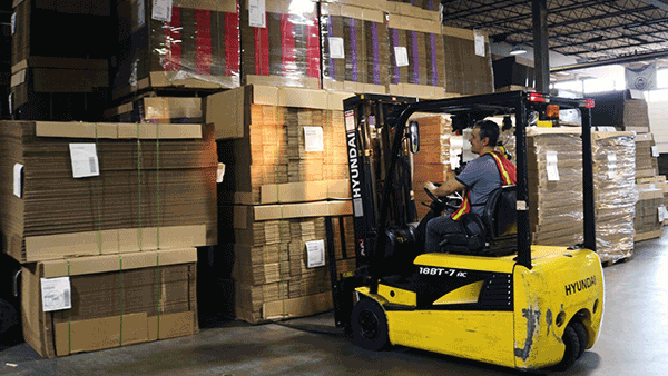 Man in Forklift in warehouse