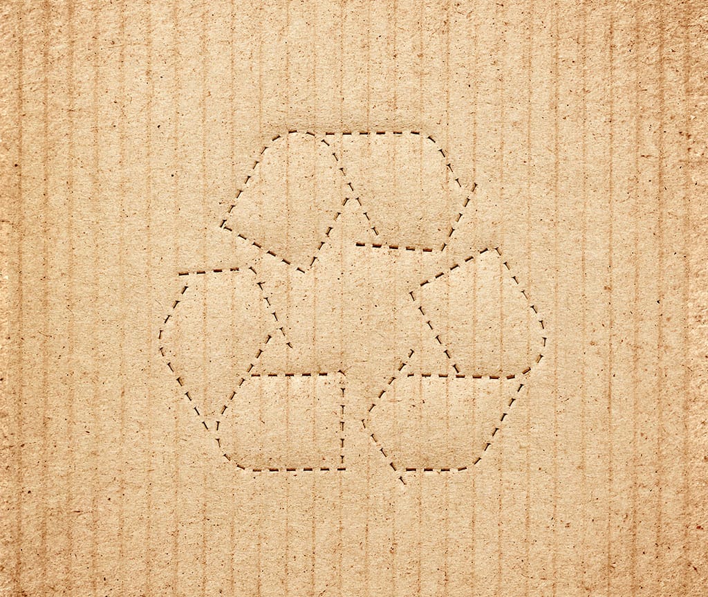 Corrugated box outlined with the recycle symbol.