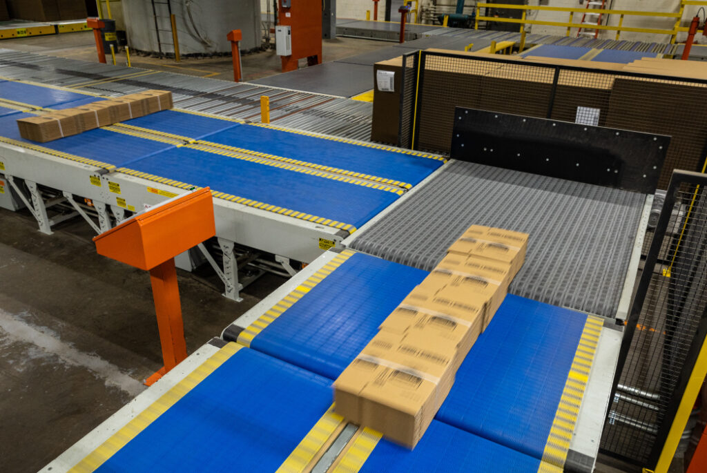 Corrugated boxes moving down a conveyor.