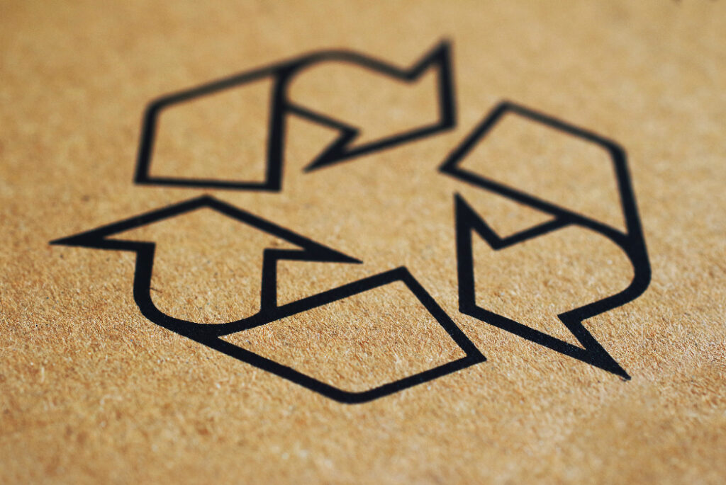 Close up shot of the recycling symbol on a corrugated box.