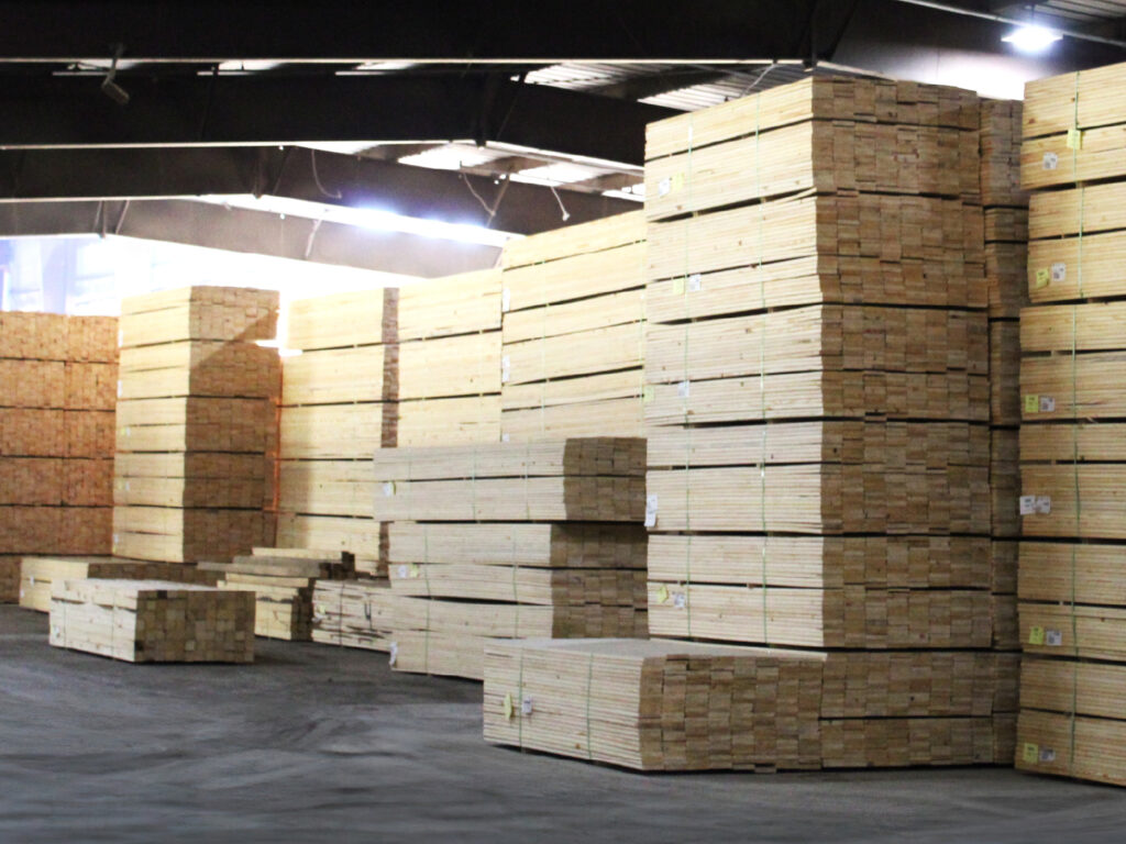 Stacks of lumber within a warehouse at the Green Bay Packaging Pinecrest Lumber Division.