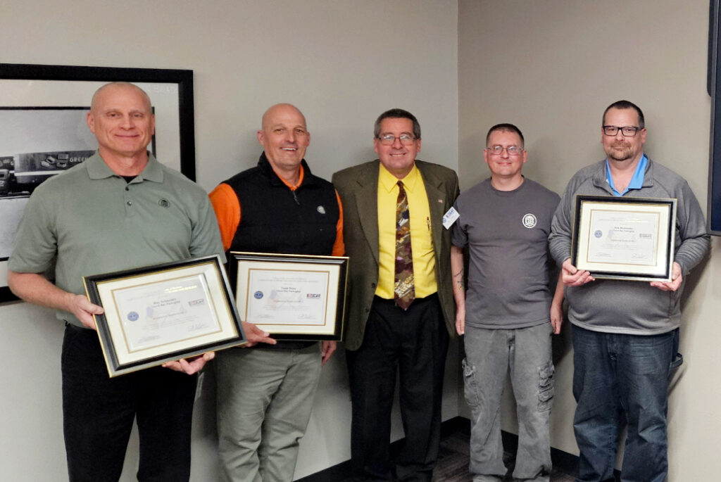 Group of Green Bay Packaging Employees standing with the ESGR official for the ESGR awards.