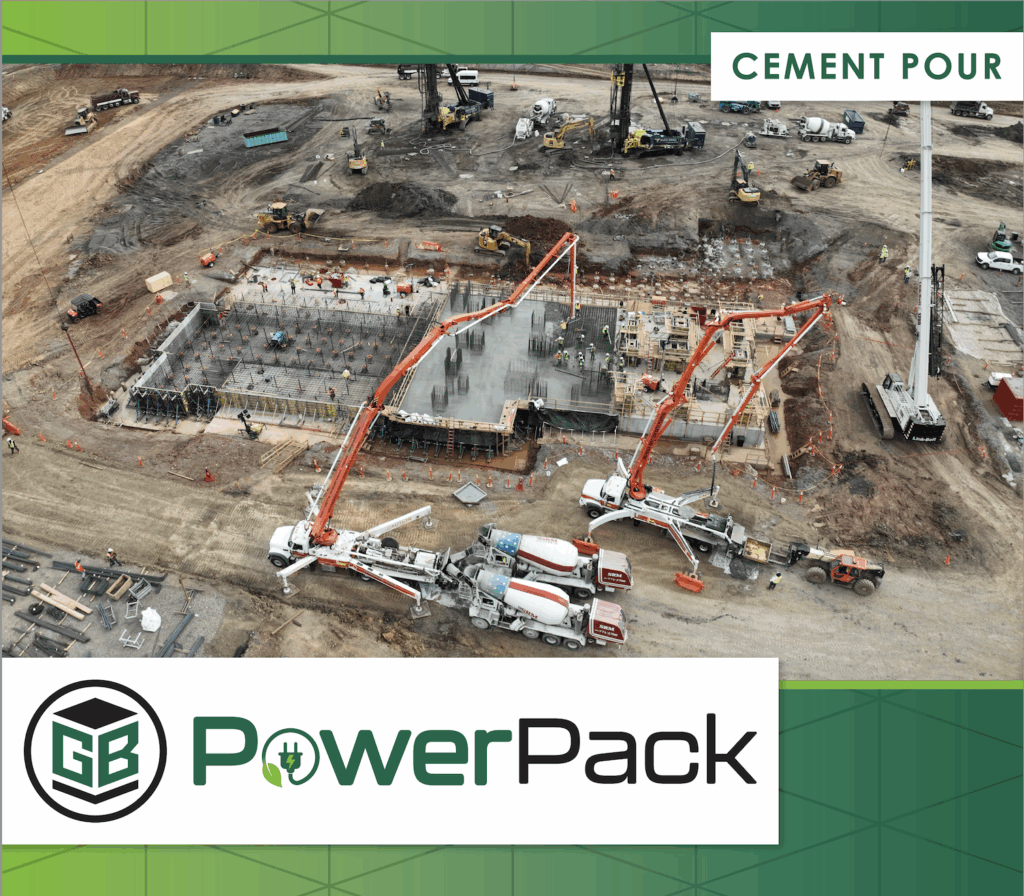 Aerial drone image of Project PowerPack concrete pouring, showing concrete pump trucks and crews placing cement for a large-scale commercial construction foundation.