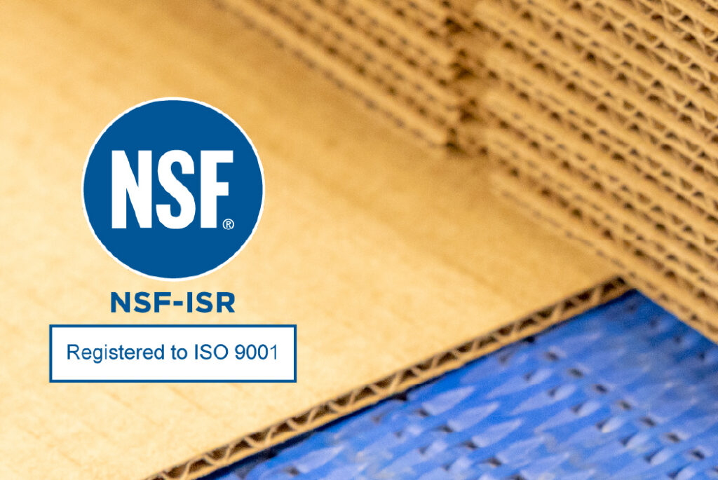 NSF‑ISR ISO 9001 certification logo overlaying stacked corrugated cardboard sheets on a packaging production line.