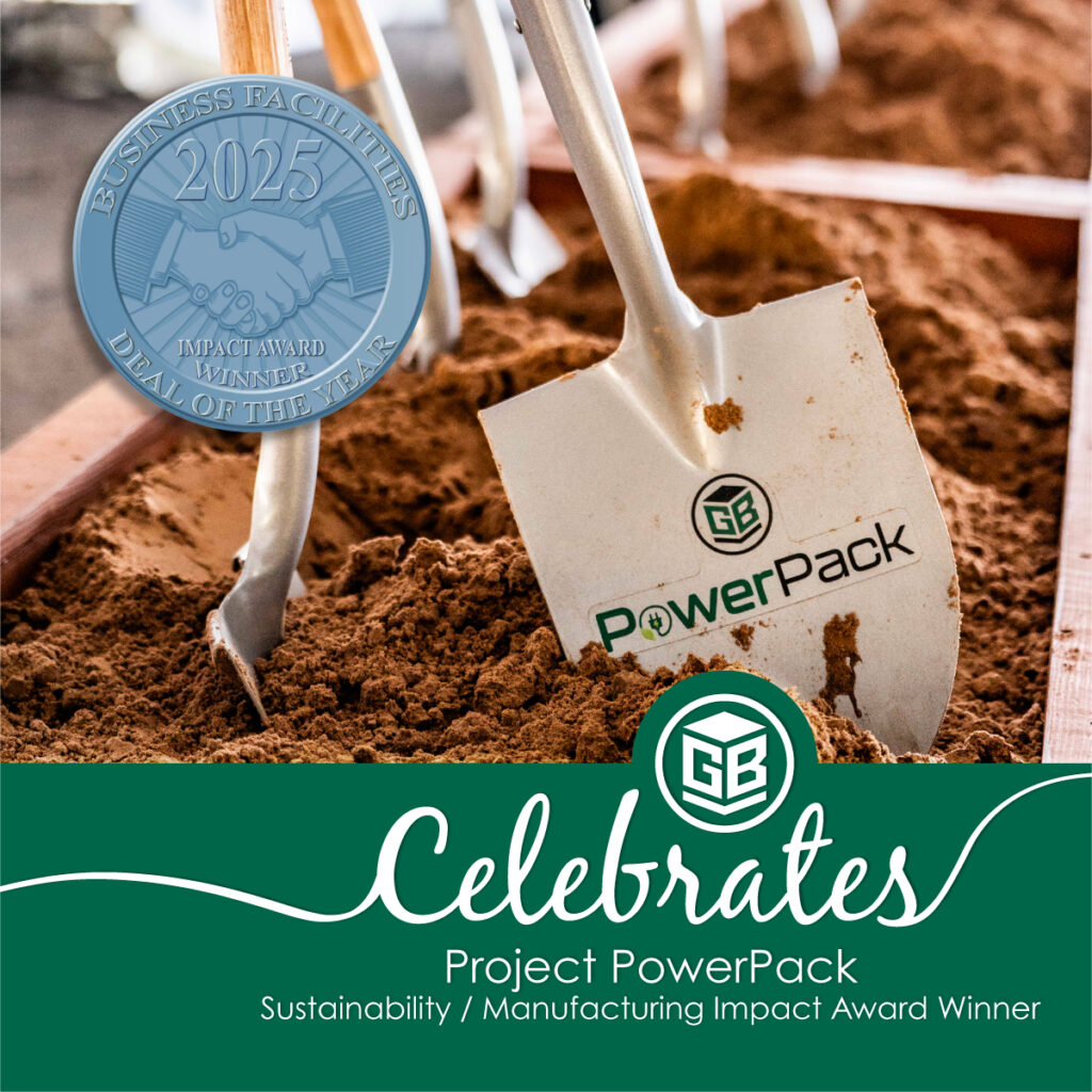 Shovel with Green Bay Packaging PowerPack logo in soil next to a Business Facilities 2025 Impact Award badge, celebrating Project PowerPack for sustainability and manufacturing impact.